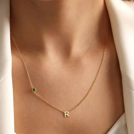 18K Gold initial letter necklace - made in real solid gold. Great for layering with other necklaces or minimalist wear. Can be personalized in Arabic or English. Crafted to the highest standards and is made at our jewelry workshop in Dubai at the United Arab Emirates.