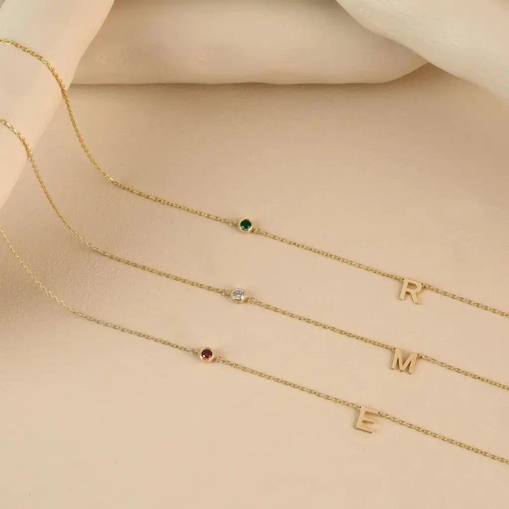 18K Gold initial letter necklace - made in real solid gold. Great for layering with other necklaces or minimalist wear. Can be personalized in Arabic or English. Crafted to the highest standards and is made at our jewelry workshop in Dubai at the United Arab Emirates.