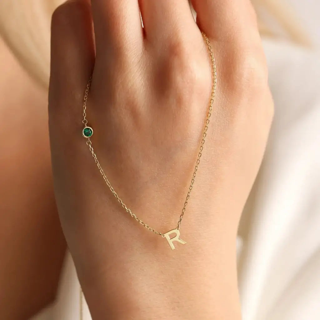 18K Gold initial letter necklace - made in real solid gold. Great for layering with other necklaces or minimalist wear. Can be personalized in Arabic or English. Crafted to the highest standards and is made at our jewelry workshop in Dubai at the United Arab Emirates.