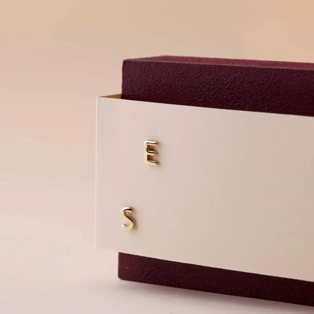 A beautiful pair of English alphabet gold initial earrings, handcrafted with a modern and minimal design that will shine radiantly and captures the eye with its charismatic brilliance. Adaptable to any style, and perfect to wear on any occasion. Beautifully handmade to the highest standards in the United Arab Emirates.