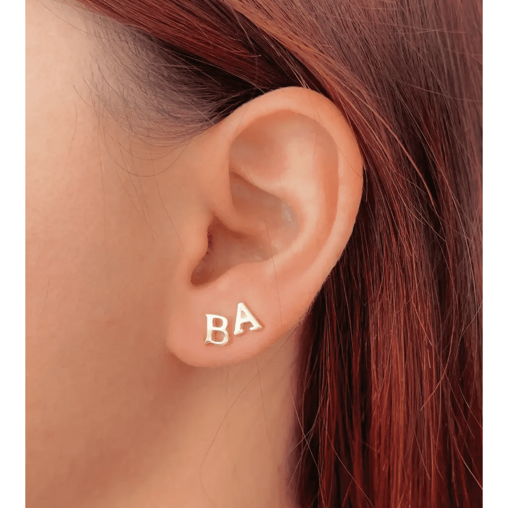 A beautiful pair of English alphabet gold initial earrings, handcrafted with a modern and minimal design that will shine radiantly and captures the eye with its charismatic brilliance. Adaptable to any style, and perfect to wear on any occasion. Beautifully handmade to the highest standards in the United Arab Emirates.