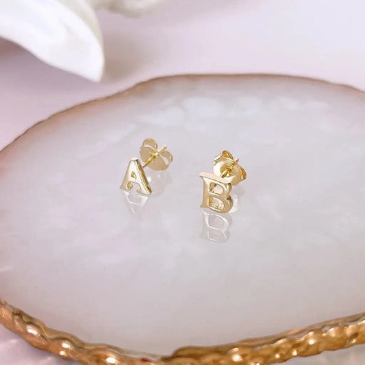 A beautiful pair of English alphabet gold initial earrings, handcrafted with a modern and minimal design that will shine radiantly and captures the eye with its charismatic brilliance. Adaptable to any style, and perfect to wear on any occasion. Beautifully handmade to the highest standards in the United Arab Emirates.