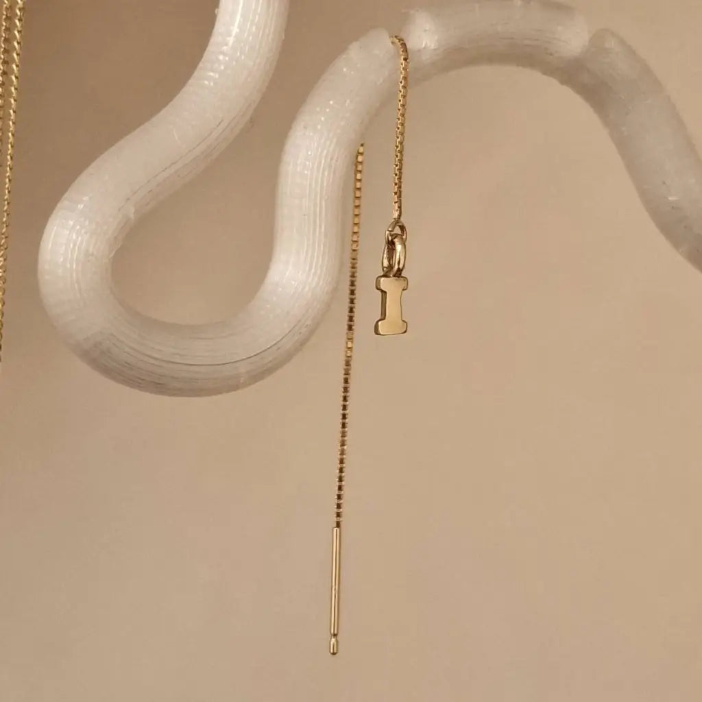 This pair of gold initial earrings is locally handcrafted with the highest quality materials and artisans available in Dubai. Our jewelry is locally handcrafted with the highest quality materials and artisans available in Dubai.
