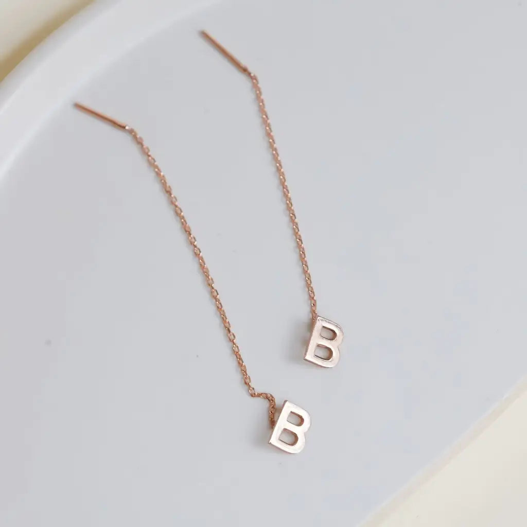 This pair of gold initial earrings is locally handcrafted with the highest quality materials and artisans available in Dubai. Our jewelry is locally handcrafted with the highest quality materials and artisans available in Dubai.
