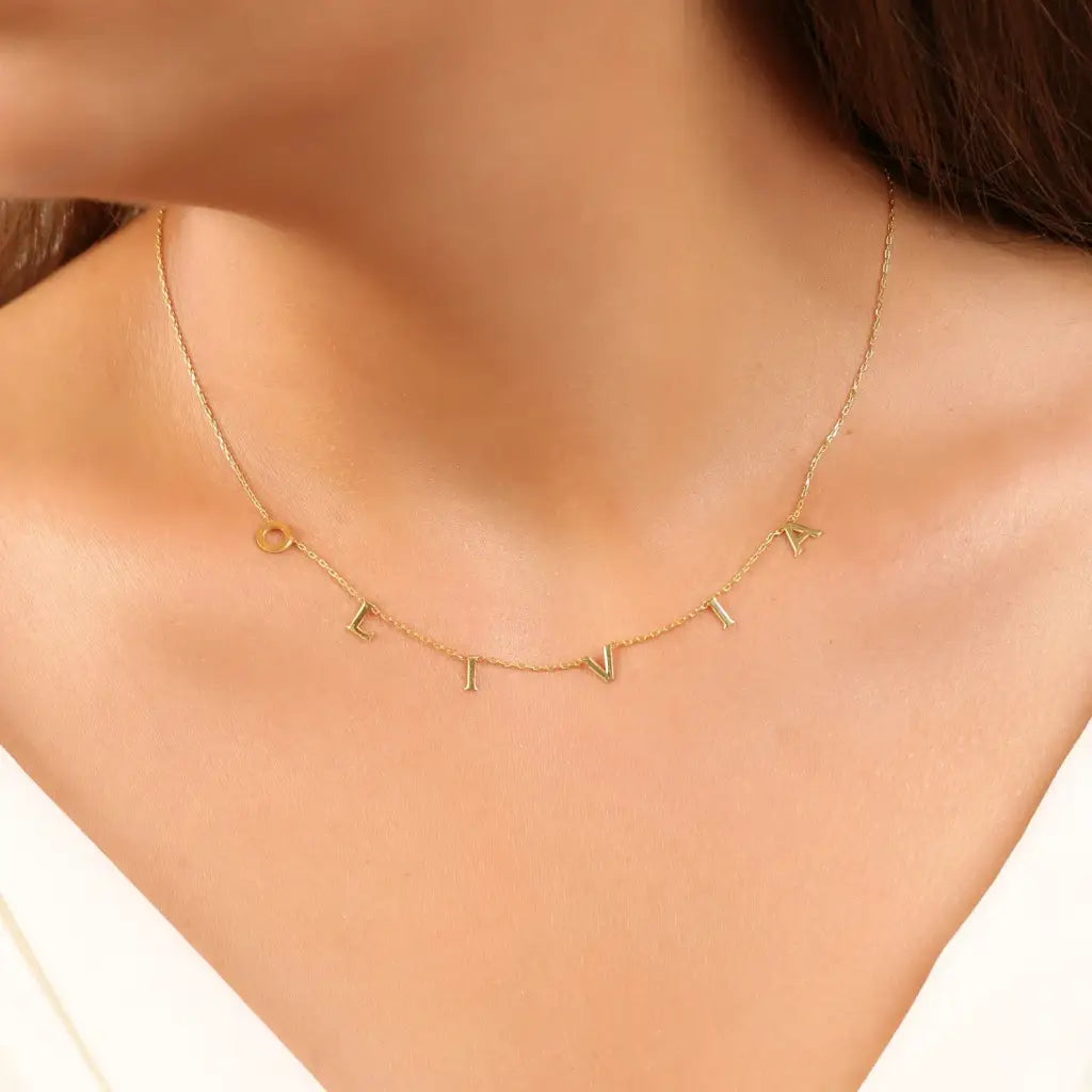 Gold Alphabet Letter Necklace Customized and handcrafted in the UAE.