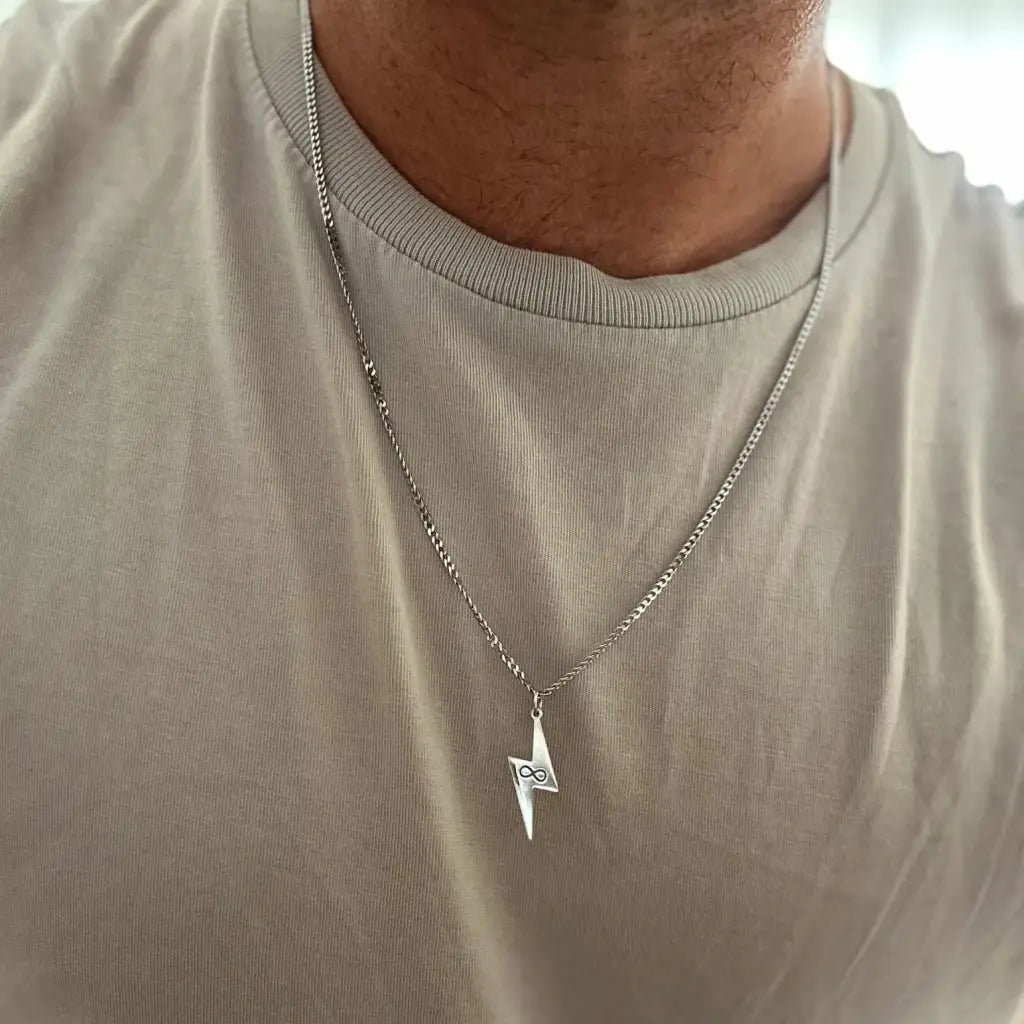 Luxury Gold Lightning Bolt Name Necklace for him made of genuine 18k solid gold. A thoughtful luxury anniversary gift for your boyfriend or husband, and the perfect expensive birthday gift for a father or a brother.