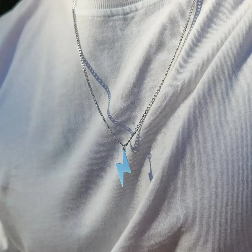 Luxury Gold Lightning Bolt Name Necklace for him made of genuine 18k solid gold. A thoughtful luxury anniversary gift for your boyfriend or husband, and the perfect expensive birthday gift for a father or a brother.