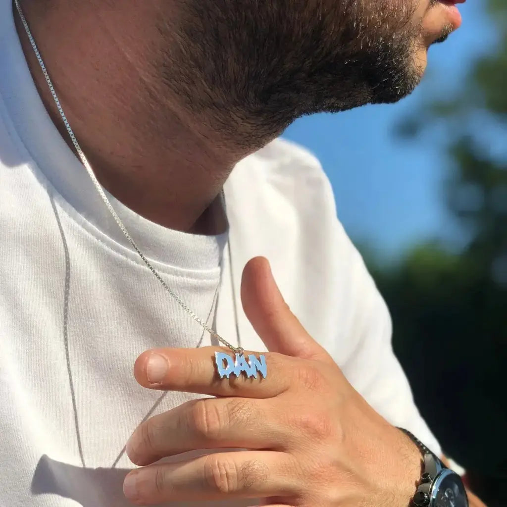 Luxury gold name necklace for him made of genuine 18k solid gold and personalized with the initials/words of your choice. A thoughtful luxury anniversary gift for your boyfriend or husband, and the perfect expensive birthday gift for a father or a brother.
