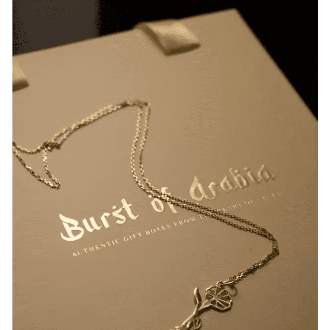Personalized Baby Feet Necklace Designed and handcrafted in the UAE.
