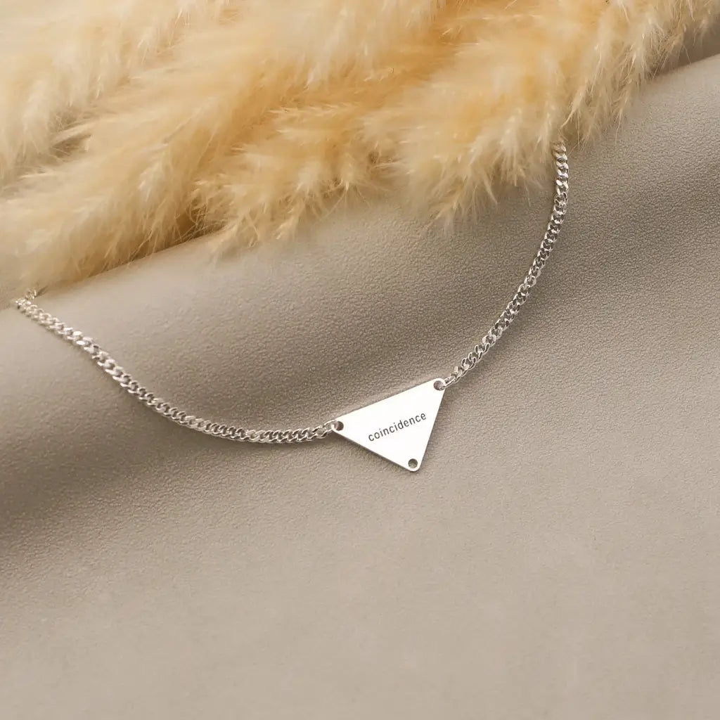 Luxury Gold Pyramid-shaped Name Necklace for him made of genuine 18k solid gold and personalized with the letters/numbers of your choice. A thoughtful luxury anniversary gift for your boyfriend or husband, and the perfect expensive birthday gift for a father or a brother.
