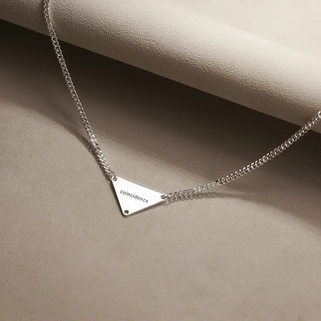 Luxury Gold Pyramid-shaped Name Necklace for him made of genuine 18k solid gold and personalized with the letters/numbers of your choice. A thoughtful luxury anniversary gift for your boyfriend or husband, and the perfect expensive birthday gift for a father or a brother.