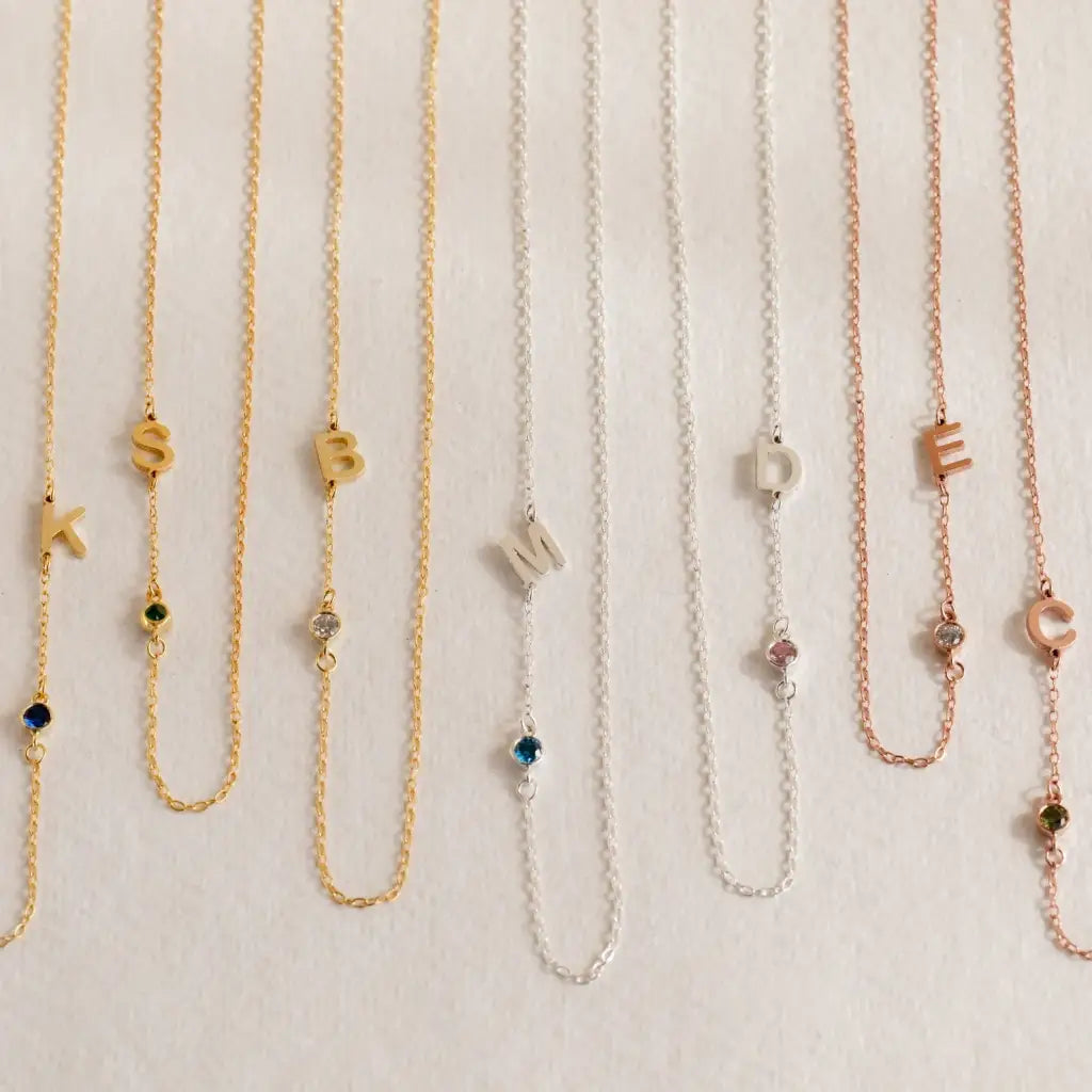 Gold sideways letter necklace - made in real solid gold. The perfect gift for your loved ones and is also great for layering with other necklaces or minimalist wear. Can be personalized in Arabic or English. Crafted to the highest standards and is made at our jewelry workshop in Dubai at the United Arab Emirates.