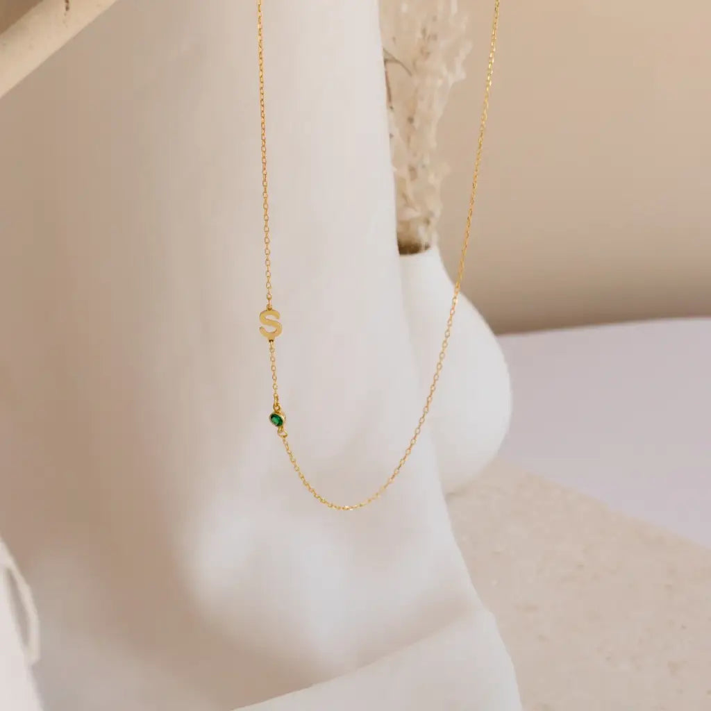 Gold sideways letter necklace - made in real solid gold. The perfect gift for your loved ones and is also great for layering with other necklaces or minimalist wear. Can be personalized in Arabic or English. Crafted to the highest standards and is made at our jewelry workshop in Dubai at the United Arab Emirates.