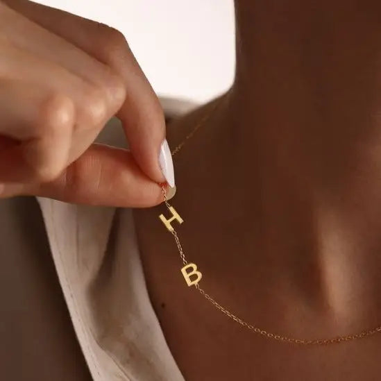 Trendy and elegant, this minimal gold alphabet pendant has a playful charm. This gold necklace is attached to a fine chain made of genuine solid gold and personalized with the initials of your choice. A great addition to your jewelry collection and a thoughtful gift for the loved ones. Designed in Dubai.