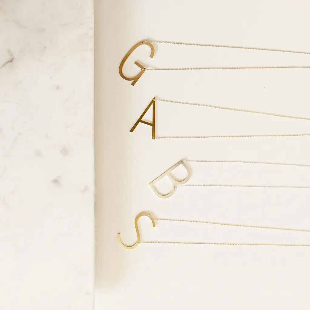 This big letter gold initial necklace is locally handcrafted with the highest quality materials and artisans available in Dubai. Great addition to your collection or perfect gift for a loved one.