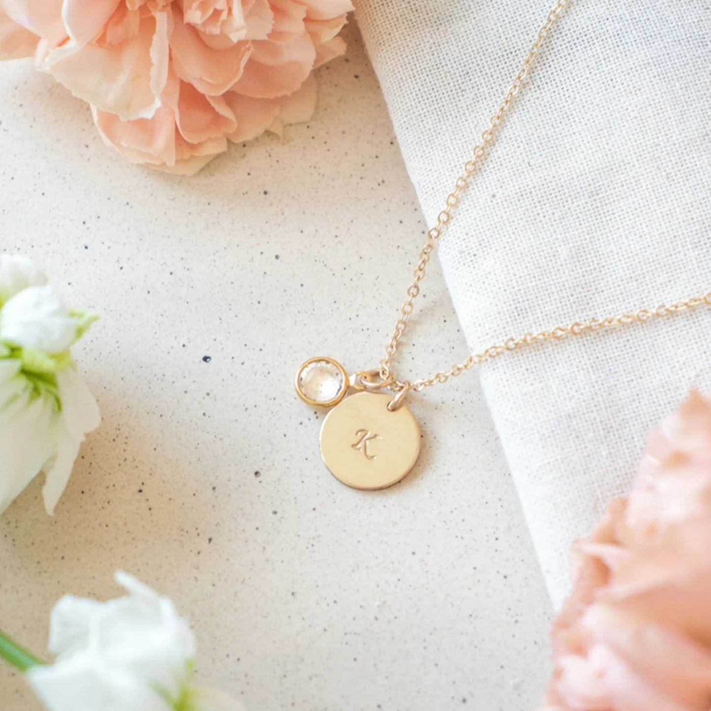 Personalized Alphabet Initial Birthstone Necklace. Locally designed and handcrafted. Delivered in 3-5 days across Dubai and the UAE.