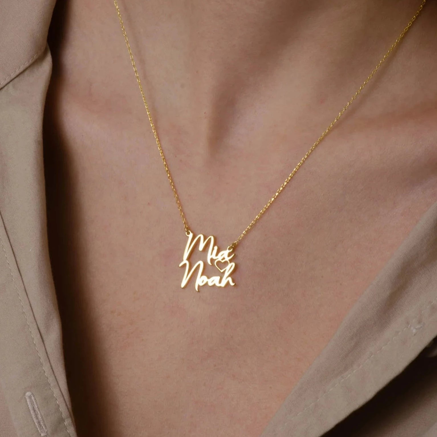 Gold Two Names Necklace - A symbol of personalized elegance by Burst of Arabia. Crafted with precision, this exquisite piece adds a touch of individuality to your style. Order now for a uniquely cherished accessory.