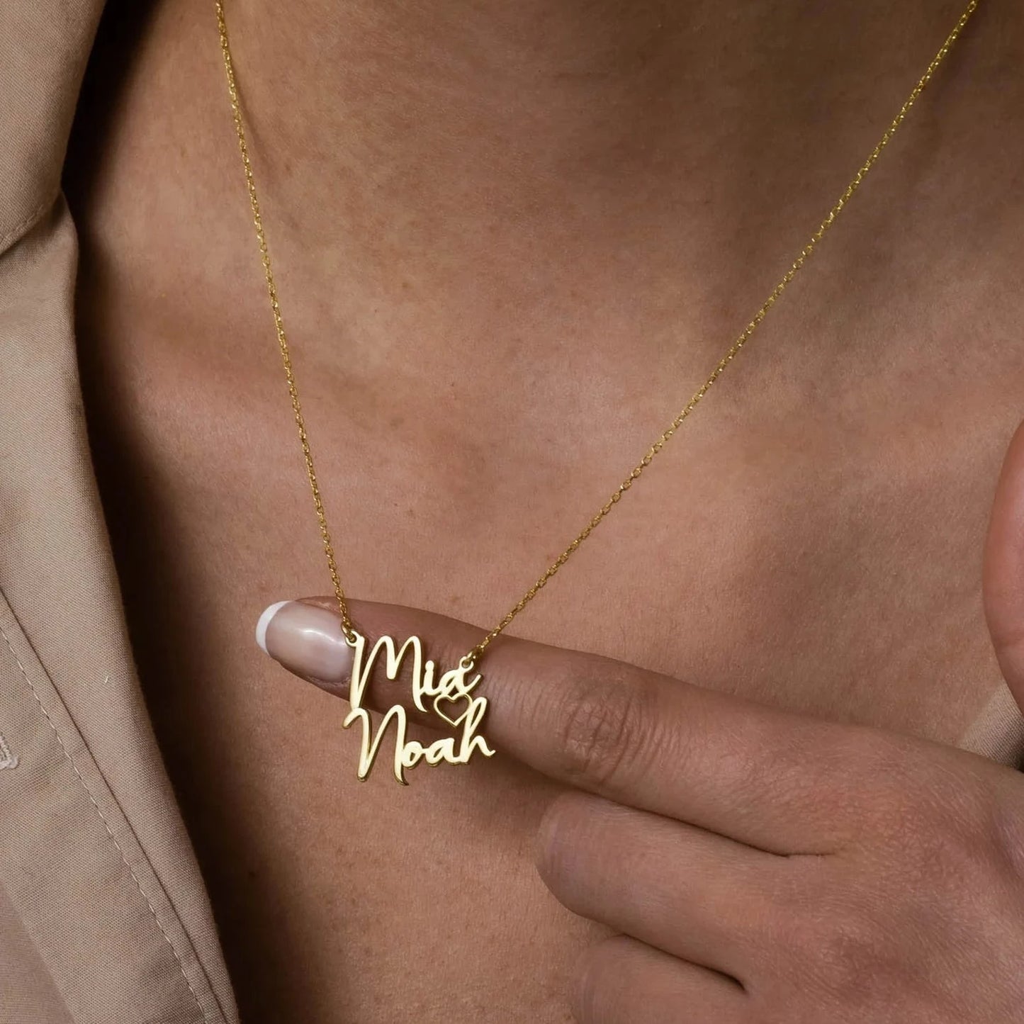 "Gold Two Names Necklace - A symbol of personalized elegance by Burst of Arabia. Crafted with precision, this exquisite piece adds a touch of individuality to your style. Order now for a uniquely cherished accessory."