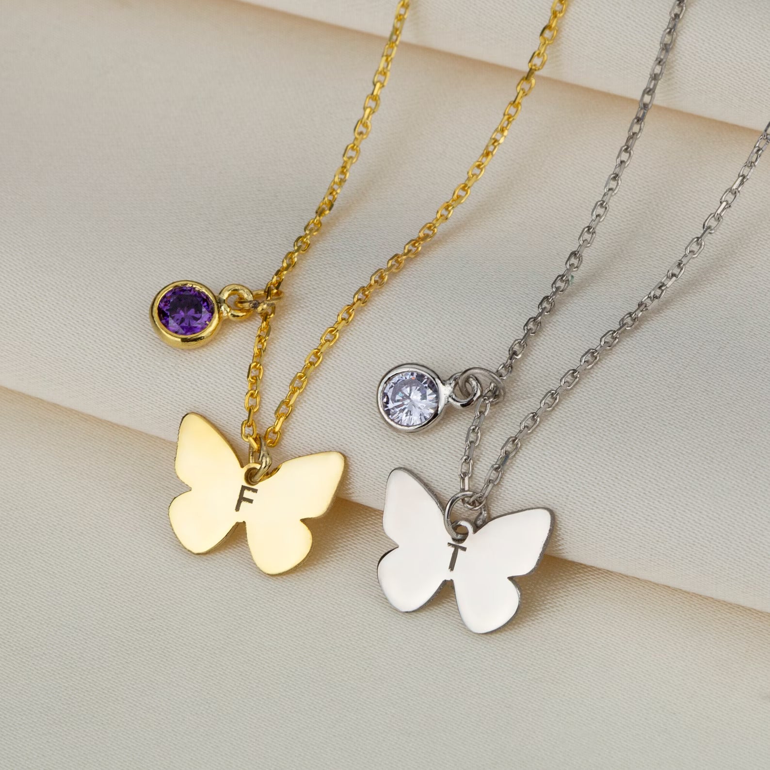 Personalized Gold Butterfly Initial Birthstone Necklace Designed and handcrafted in the UAE.  Pamper your loved one with this exquisite 18 carat gold butterfly initial birthstone necklace, complete with a delicate gold butterfly, birthstone and the initial of your choice.