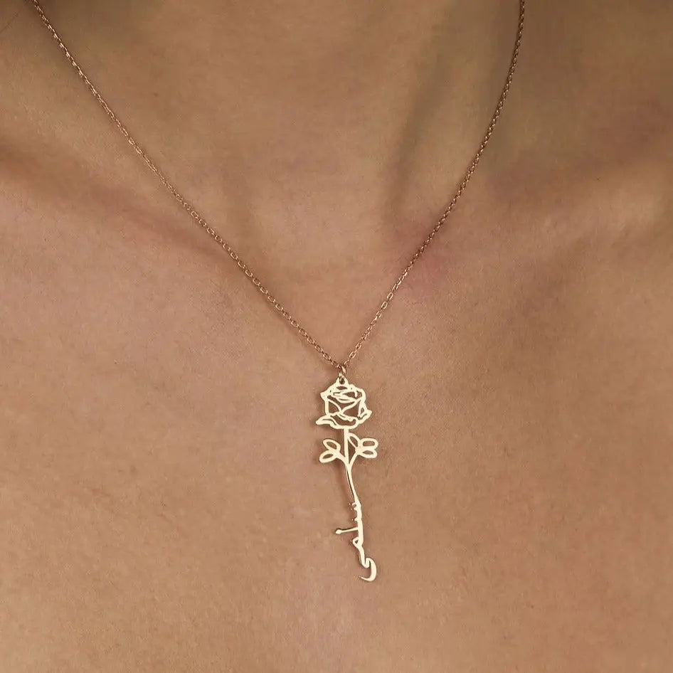 Gold Birth Flower Name Necklace made in real gold. Designed and handcrafted in the UAE. This gold birth flower Arabic name pendant is locally handcrafted with the highest quality materials and artisans available in Dubai.