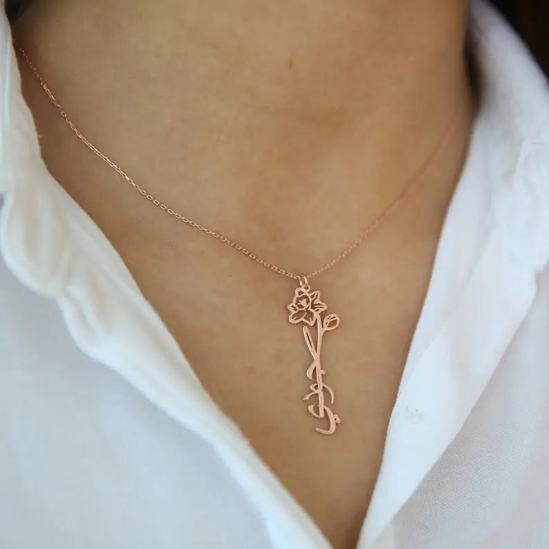 Gold Birth Flower Name Necklace made in real gold. Designed and handcrafted in the UAE. This gold birth flower Arabic name pendant is locally handcrafted with the highest quality materials and artisans available in Dubai.