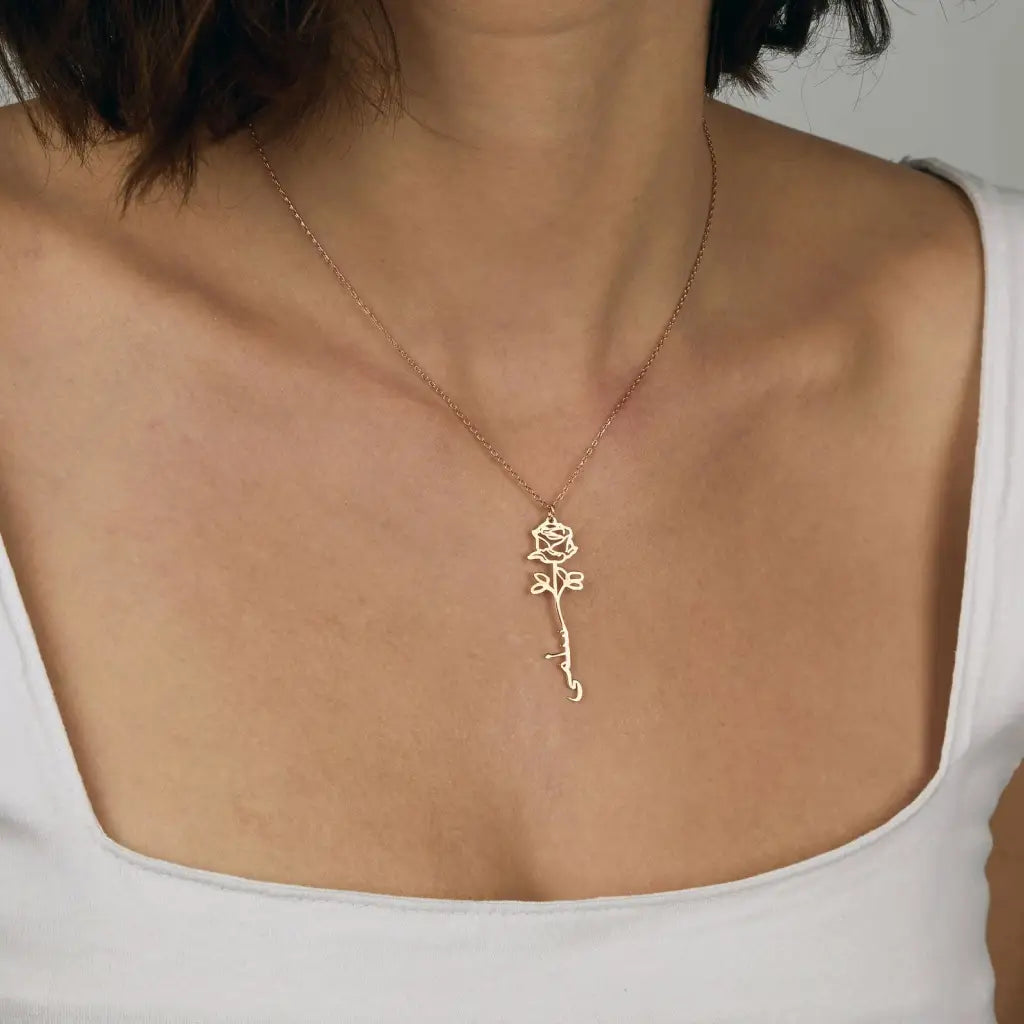 Gold Birth Flower Name Necklace made in real gold. Designed and handcrafted in the UAE. This gold birth flower Arabic name pendant is locally handcrafted with the highest quality materials and artisans available in Dubai.