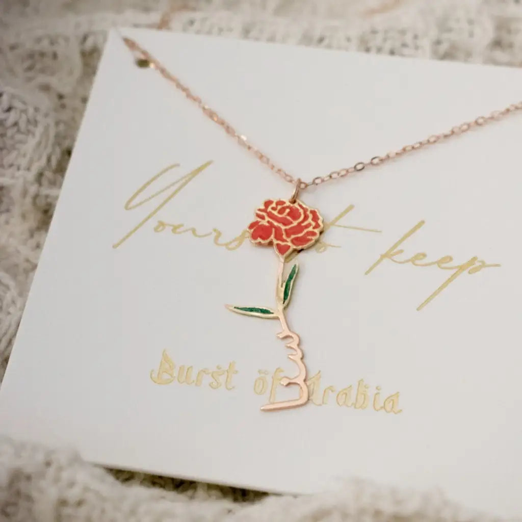 Gold Birth Flower Name Necklace made in real gold. Designed and handcrafted in the UAE. This gold birth flower Arabic name pendant is locally handcrafted with the highest quality materials and artisans available in Dubai.