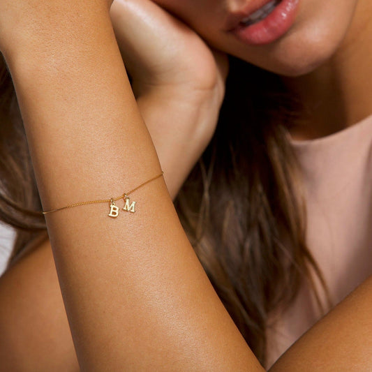 First anniversary jewelry ideas for her featuring personalized gold necklaces, birthstone necklaces, and thoughtful gift options to celebrate love and commitment