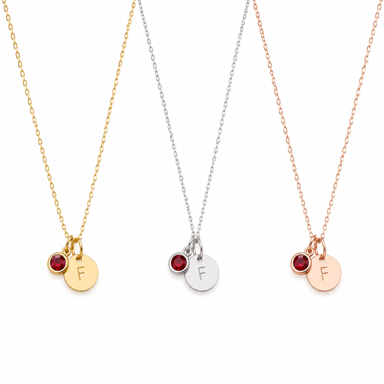 Alphabet Initial Birthstone Necklace available in solid 18K yellow gold, white gold and rose gold on a white background.