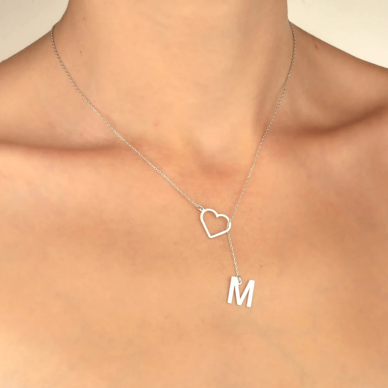 Elevate your style with the Dangle Letter Necklace with Heart. Personalize your initial and order today!