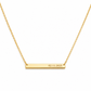 A gold bar necklace with a delicate cable chain, featuring a horizontal rectangular pendant engraved with the date '02.11.