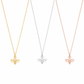 Three delicate necklace chains with small bee-shaped pendants in yellow gold, silver, and rose gold, displayed against a plain white background.