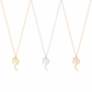 Three horse-shaped pendant necklaces on delicate chains, shown in gold, white, and rose gold finishes against a clean white background.