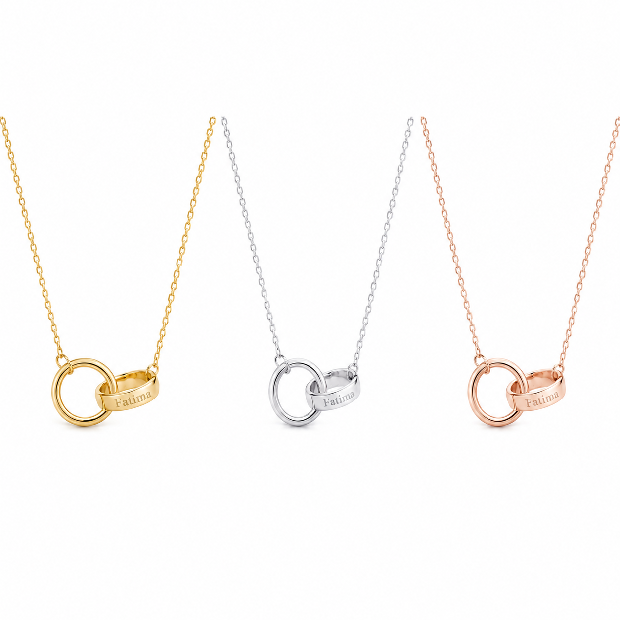 Three interlocking ring pendant necklaces on delicate chains, shown in gold, silver, and rose gold finishes against a plain white background.