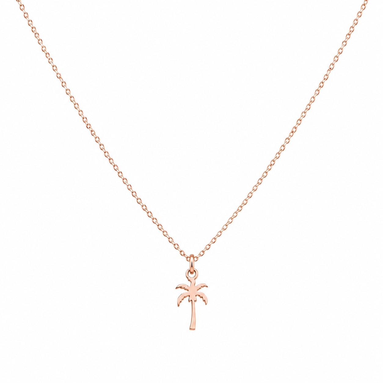 A delicate rose gold chain necklace with a small palm tree pendant, displayed against a solid white background.