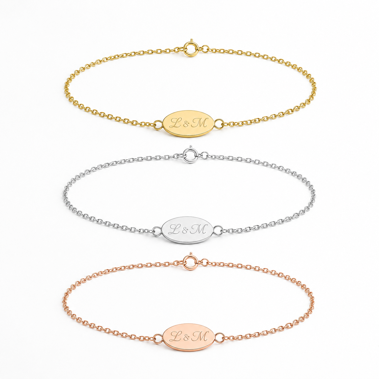 Three personalized chain bracelets with oval initial plates engraved with 'BsM', shown in gold, silver, and rose gold tones on a clean white background.