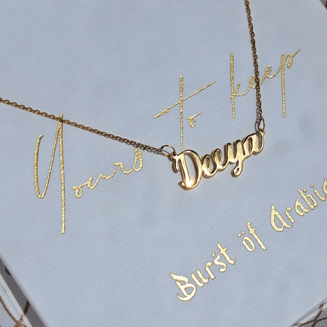 Alphabet name necklace, designed in Dubai with 18 carat gold, available in three colors: yellow gold, white gold, rose gold. Fast delivery across the UAE.