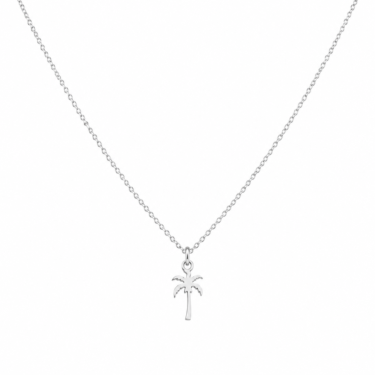 A delicate white gold chain necklace featuring a small palm tree pendant, shown against a plain white background.