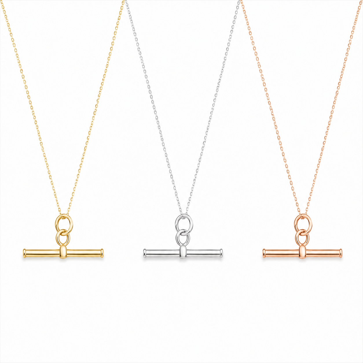 Three t-bar necklaces on delicate chains, shown side by side in yellow gold, silver, and rose gold tones against a clean white background.