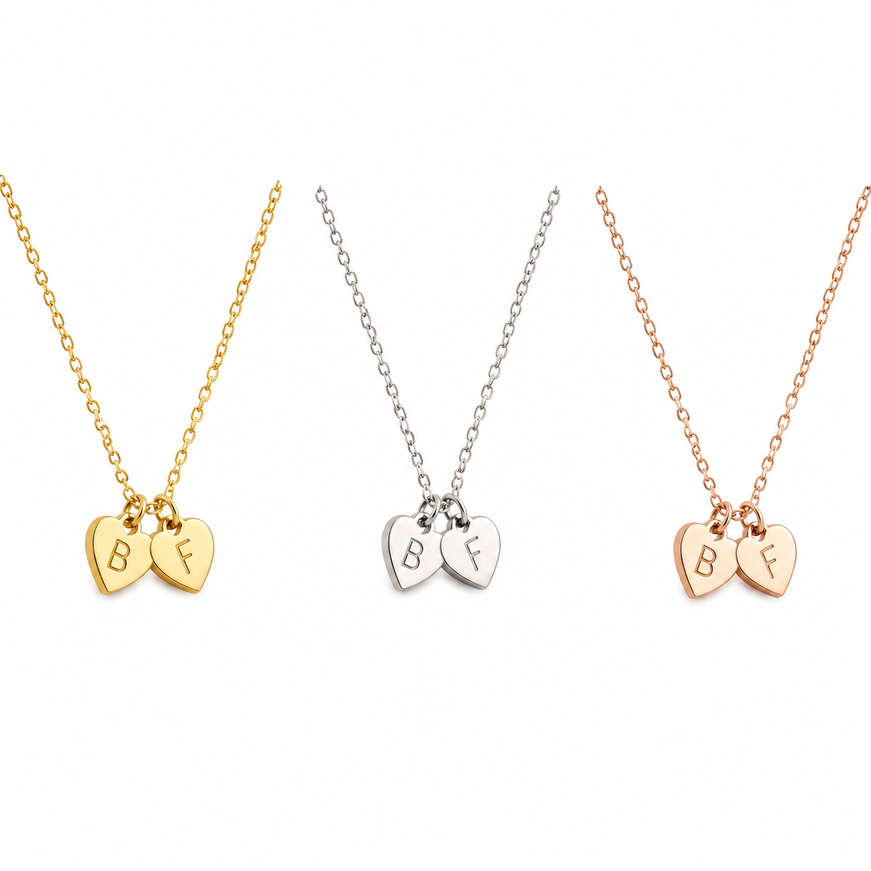 Tiny Engraved Heart Necklace handcrafted in solid 18K gold. Personalise each heart with an initial. Available in yellow, white and rose gold.