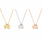 Tiny Engraved Heart Necklace handcrafted in solid 18K gold. Personalise each heart with an initial. Available in yellow, white and rose gold.