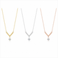Three V-shaped pendant necklaces on a white background, shown in yellow gold, silver, and rose gold finishes, each with a clear gemstone pendant.