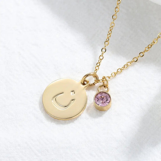 Arabic letter coin initial Necklace with birthstone Designed and handcrafted in the UAE. Delivers within 1 to 3 business days. This classic Arabic gold name necklace is locally handcrafted with the highest quality materials and artisans available in Dubai. The perfect gift to put a smile on her face. Anniversary, birthday, and luxury gifts for women.