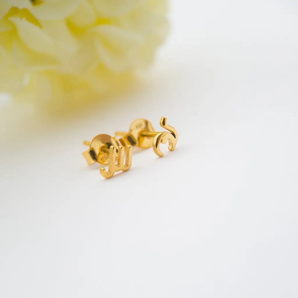 A simple and elegant design, adaptable to any style, and perfect to wear on any occasion, these Arabic initial earrings are available in 18K white, yellow, and rose gold. The perfect gift for a loved one. Beautifully handmade to the highest standards in the United Arab Emirates.