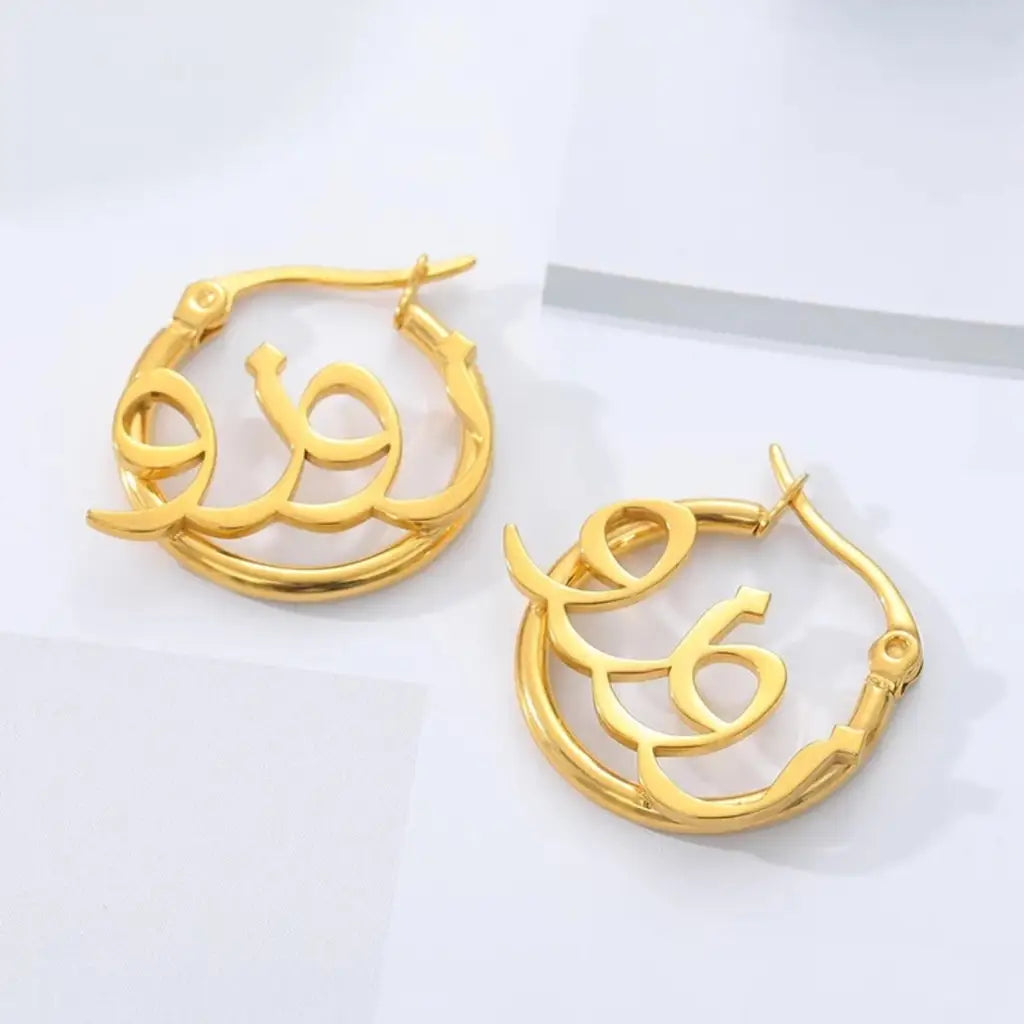 Arabian name earrings made in real gold. Designed and handcrafted in the UAE. These gorgeous authentic Arabic name earrings are locally handcrafted with the highest quality materials and artisans available in Dubai.