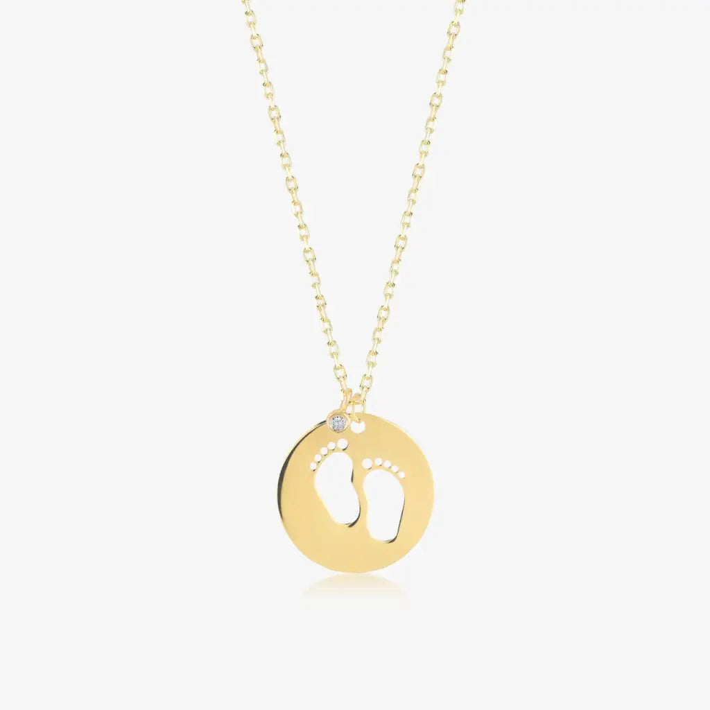 18K Gold Baby Feet Birthstone Necklace Designed and handcrafted in the UAE.
