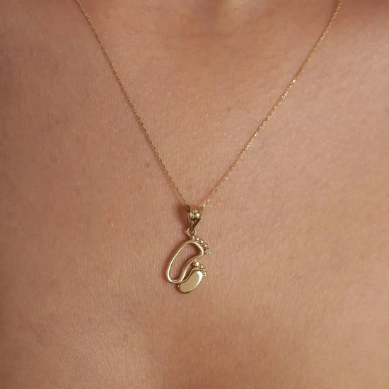 18K Gold Personalized Baby Feet Necklace Designed and handcrafted in the UAE.