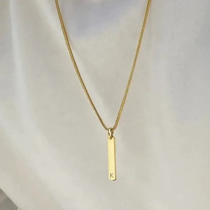 Luxury gold bar engraved pendant made of genuine 18k solid gold and personalized with the initials/words of your choice. A thoughtful luxury anniversary gift for your boyfriend or husband, and the perfect expensive birthday gift for a father or a brother.