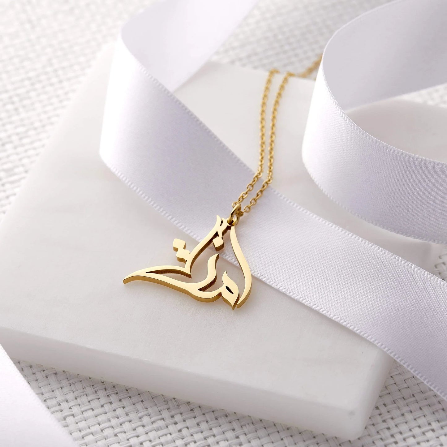 Gold calligraphy necklace, Dubai, UAE