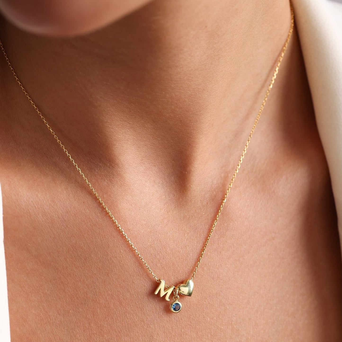 18 carat gold necklace for women - initial, heart and birthstone chain for her. Shop the finest birthday gifts for women in the UAE.